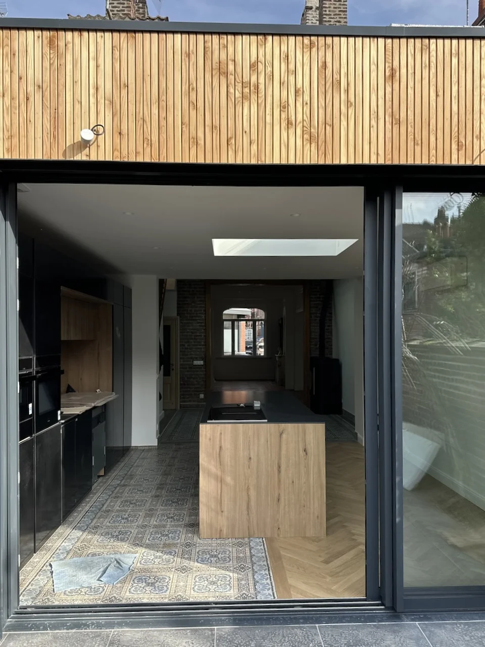 Rénovation clé en main d'une maison de 1908 à La Madeleine - après, l'extension en bardage bois
